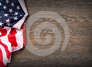 US flag on wooden background. N