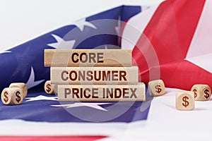 On the US flag and wooden plates with the inscription - core consumer price index