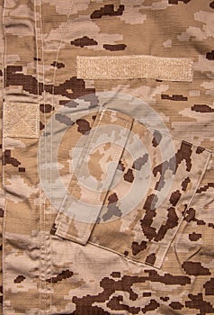 US marine desert marpat digital camouflage fabric texture back. Close-up of a fragment of a military uniform