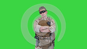 US marine ranger with folded arms on a Green Screen, Chroma Key.