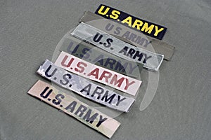 US military service tapes on olive green uniform