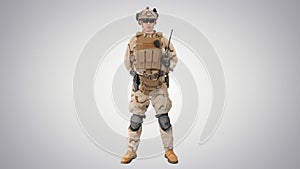 US Military Soldier in Uniform Reports on gradient background.