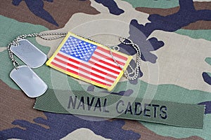 US NAVAL CADETS branch tape, flag patch and dog tags on woodland camouflage uniform photo