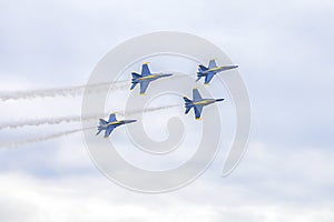 US Navy Blue Angels Hornet Fighter Jets Flying In Formation During A Performance Of Aerial Maneuvers