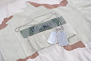 US NAVY branch tape with dog tags with dog tags on desert camouflage uniform