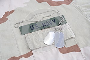 US NAVY branch tape with dog tags with dog tags on desert camouflage uniform