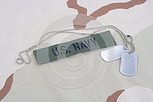 US NAVY branch tape with dog tags with dog tags on desert camouflage uniform