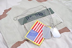 US NAVY branch tape with dog tags and flag patch on desert camouflage uniform