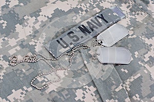 us navy camouflaged uniform with blank dog tags