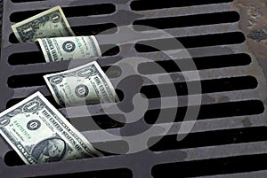 US One Dollar bills washed down the drain