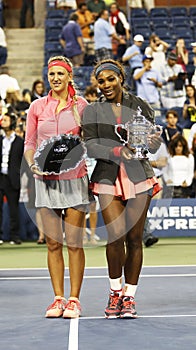 US Open 2013 champion Serena Williams and runner up Victoria Azarenka holding US Open trophies after final match