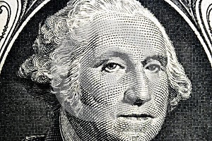 US president George Washington face portrait on the USA one dollar note. Macro shot. Background of the money. George Washington ey