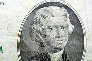 US President Thomas Jefferson face on two 2 dollars bill macro, United States of America money closeup