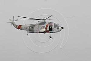 US Sikorsky helicopter during rescue maneuvers inflight over mediterranean