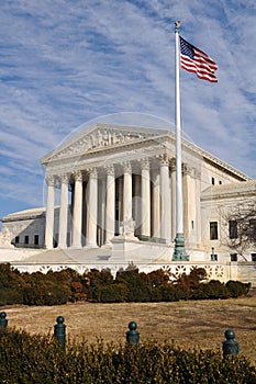 US Supreme Court Building with United States Flag