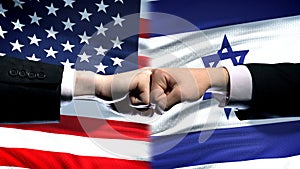 US vs Israel conflict, international relations crisis, fists on flag background