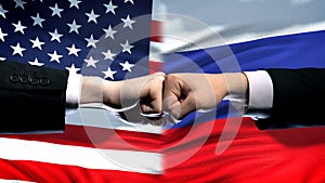 US vs Russia conflict, international relations crisis, fists on flag background