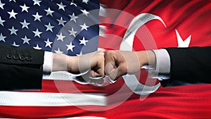 US vs Turkey conflict, international relations crisis, fists on flag background