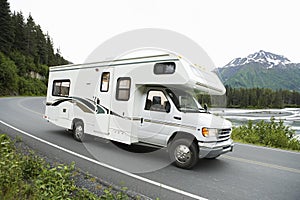 USA, Alaska, Recreational Vehicle Driving On Road photo