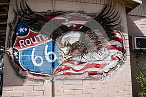 USA American flag with eagle symbol of the United States on a route 66 wall