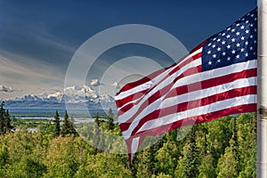 Usa American flag stars and stripes on mount McKinley Alaska background