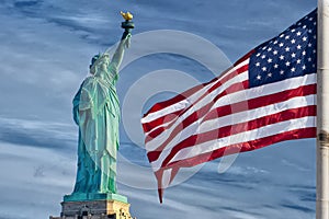 Usa American flag stars and stripes on statue of liberty blue sky background