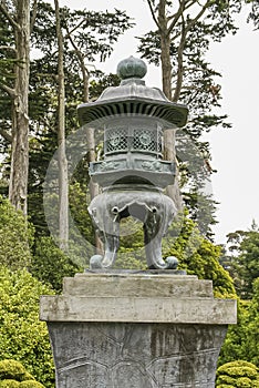 Green bronze lantern statue in Japanese Garden, San Francisco, CA, USA