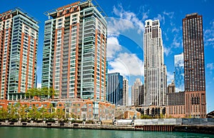 Chicago city skyscrapers on the river canal, blue sky background