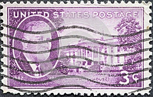 USA - Circa 1945: a postage stamp printed in the US showing a portrait by Franklin Roosevelt Stamps. Background: White House