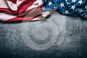 USA flag. American flag. American flag freely lying on concrete background. Close-up Studio shot. Toned Photo