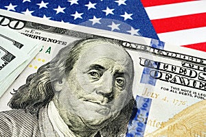 USA flag and dollar bills as symbol of stimulus check and cares act. photo