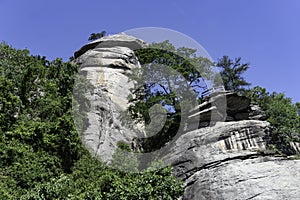 USA flag flies over the boulders of Chimney Rock.