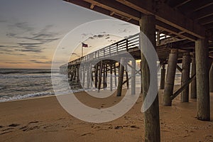 USA Flag Flying in the Predawn on a Fishing Pier