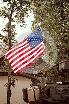USA flag mounted on armored vehicle photo