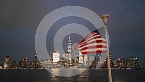 USA flag in night NYC. Memorial Day, Veteran's Day, 4th of July. American Flag Waving near New York City, Manhattan