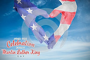 Composite image of usa flag painted on hands making heart shape