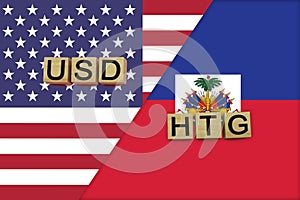 USA and Haiti currencies codes on national flags background