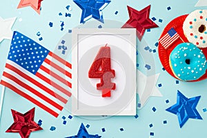 USA Independence Day concept. Top view photo of photo frame with number 4 candle star garland national flags confetti and plate