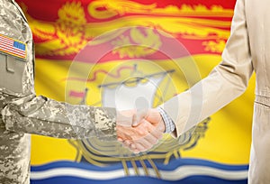 USA military man in uniform and civil man in suit shaking hands with certain Canadian province flag on background - New Brunswick