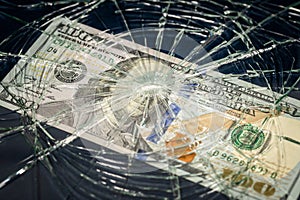 USA money, Fall of US currency, Weakening of dollar 100 dollar banknote lying behind broken glass, Financial concept or insurance