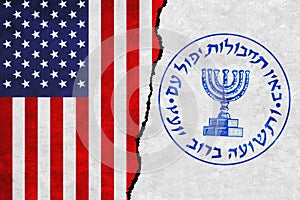USA and Mossad painted flags on a wall with a crack. United States of America and Mossad relations.