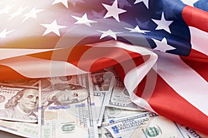 USA national flag and the currency usd money banknotes. Business and finance concept photo
