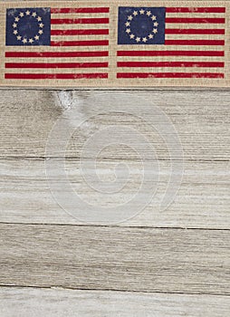 USA patriotic Betsy Ross old flag on a weathered wood background