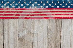 USA patriotic old flag on a weathered wood background