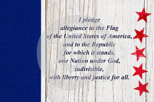 USA Pledge of Allegiance with red stars on weathered whitewash wood photo