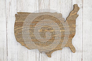 USA Pledge of Allegiance on a wood map of the America photo