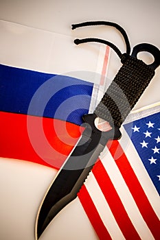 USA and Russia flags with knife - conflict