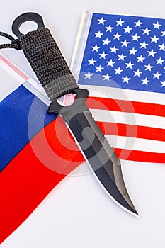 USA and Russia flags with knife - conflict