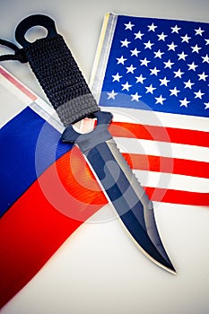 USA and Russia flags with knife - conflict
