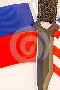 USA and Russia flags with knife - conflict